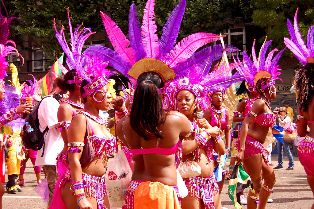 Women wearing colourful and flamboyant, Brazilian style carnival costumes.