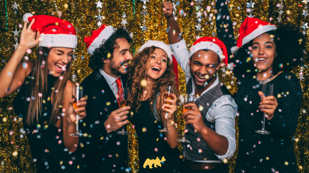 Executives at a Christmas party, with gold glitter and champagne