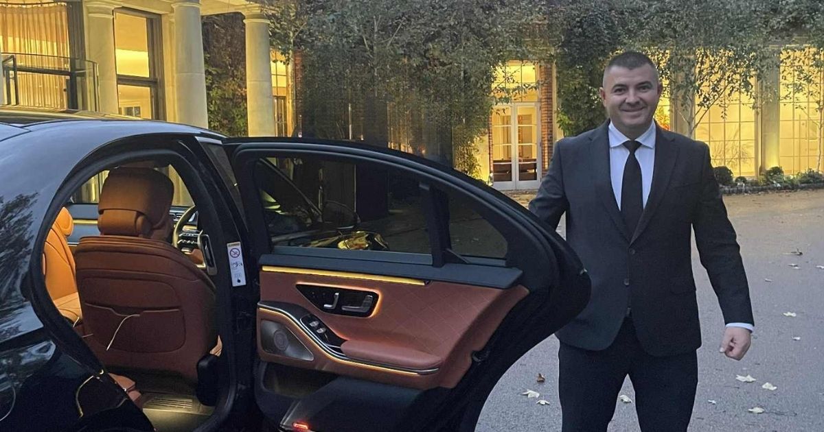 Catalin - executive chauffeur, opening the door to his Mercedes S-Class